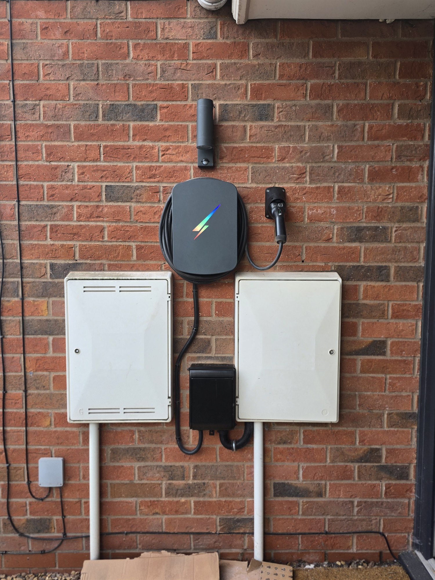 FES EV charger installation on a brick wall