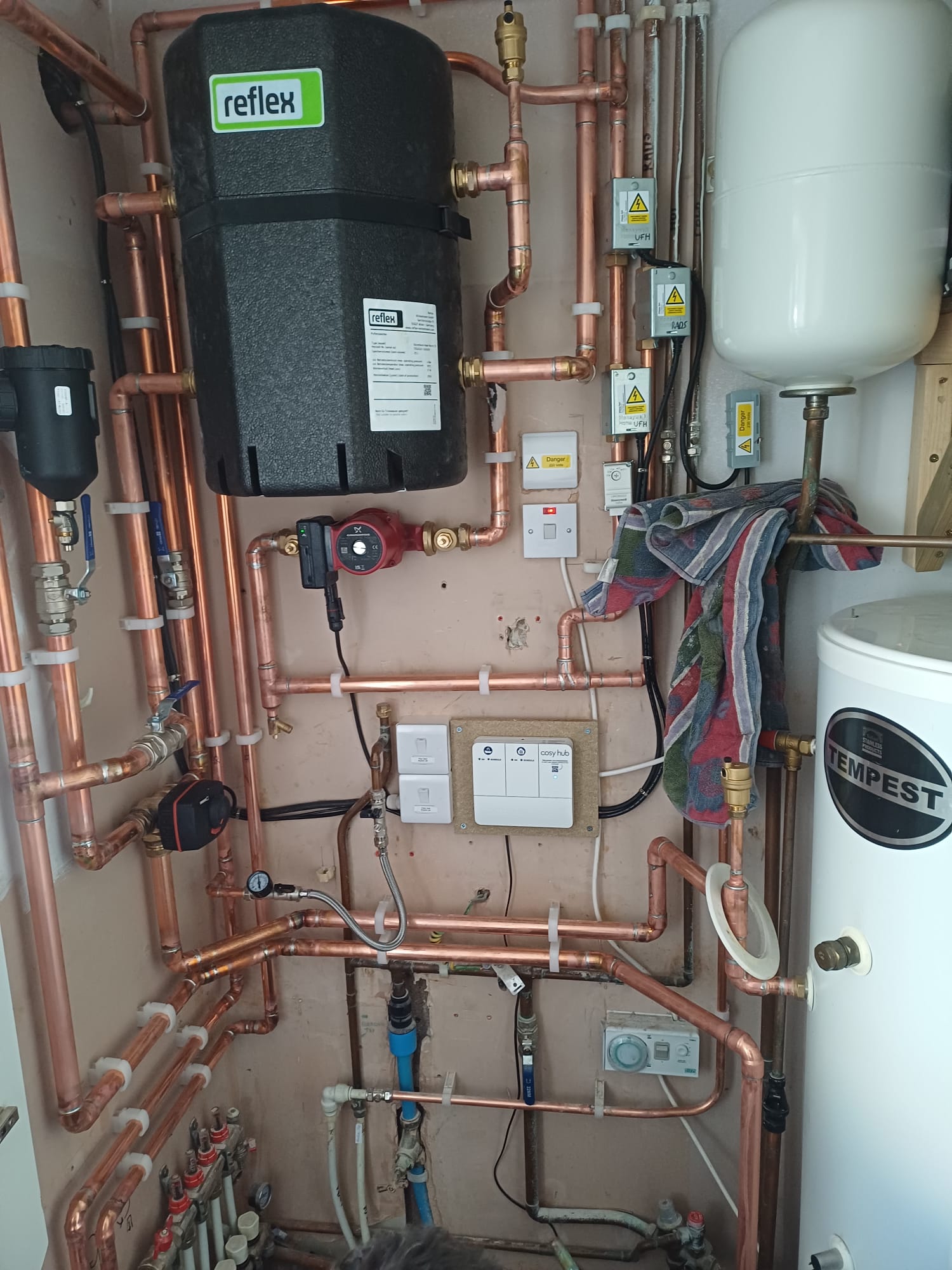 Heat pump wiring and controls installed around copper pipework